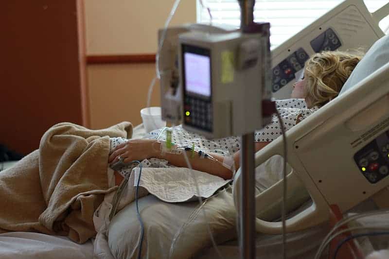 woman-lying-on-hospital-bed-inside-hospital
