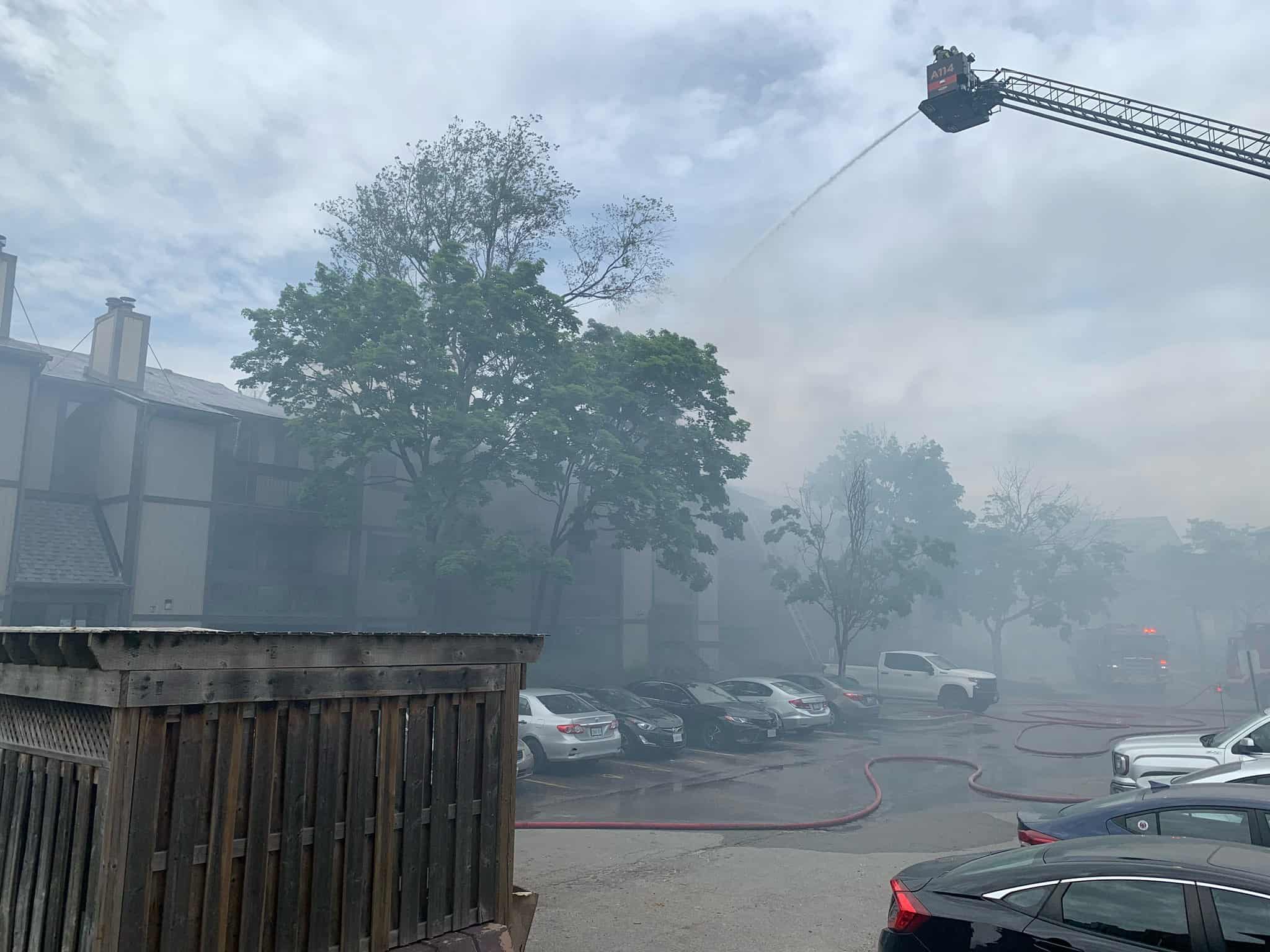 Townhouse complex surrounded in smoke.