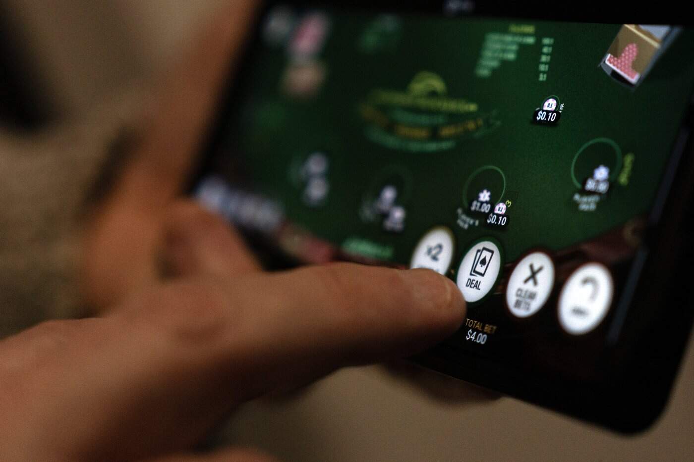 Canadians are betting record sums online — and falling in debt. Here's how to dig out