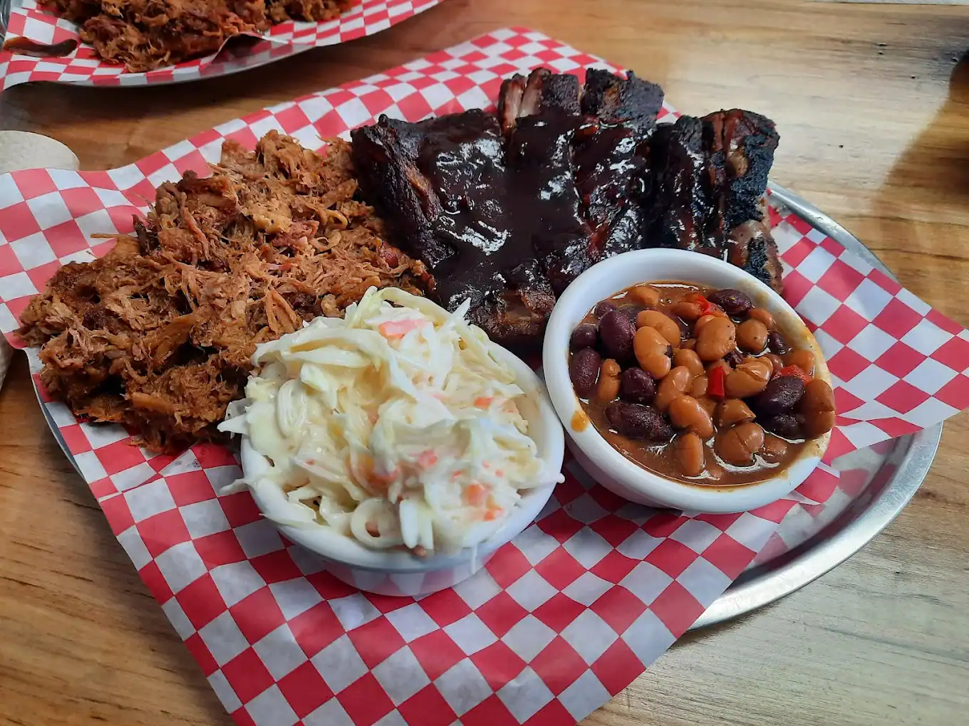 BBQ restaurant serving smoked meats and comfort foods opens new location in Milton