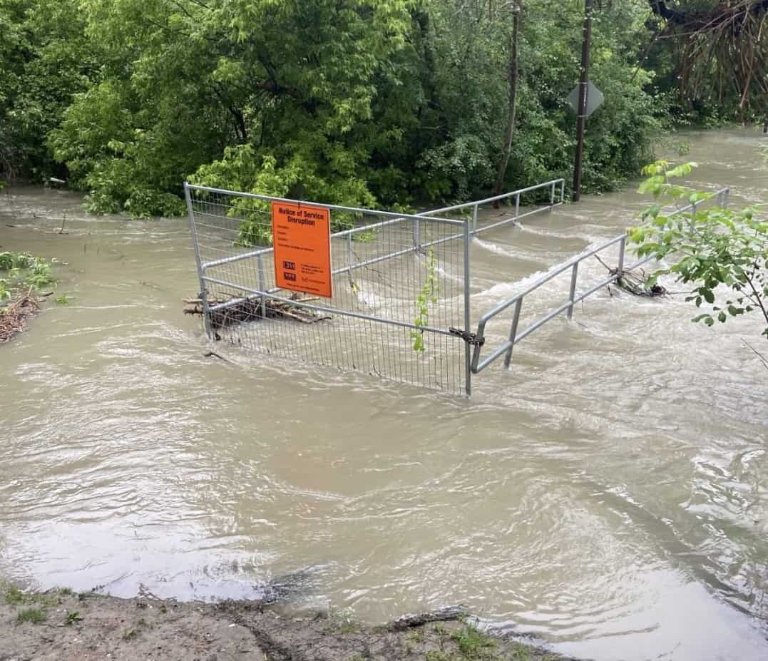 pedestrian bridge closed in mississauga due to flooding.