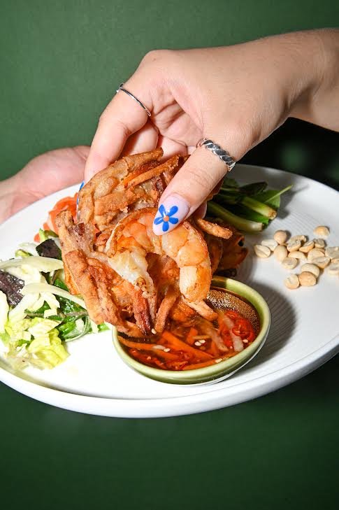 A new one-of-a-kind spot for Vietnamese cuisine is coming to Toronto.
Renso Pho-Potle is a new, cozy pho space built from the ground up with accessibility and a relaxed vibe in mind.
According to a recent release, the new location operates as a drop-in dining space where guests will be in the driver’s seat, as the entire menu offers a fully customizable pho experience.
The concept is a response to downtown Toronto’s fast-paced environment, as with a high influx of foot traffic, culinary artisans behind Renso Pho-Potle have stated that a place to drop in and get a high-quality meal made exactly the way you want is something the city has long needed.
Beyond the traditional flavours that come with the territory of the iconic broth-based Vietnamese hot noodle soup, Renso Pho-Potle is also shaking things up by offering dry pho — a reimagining of the dish that integrates the flavours of the broth dynamically.
“We’ve worked carefully to honour the flavours that make pho so distinctive, while adapting them into a format that fits modern lifestyles,” said Chef Bich Nguyen, in an official statement. “It’s about balancing the integrity of the ingredients while making the experience simple and engaging for guests.”
As a result of pursuing outside-the-box culinary endeavours, downtown Toronto’s Renso Pho-Potle will be the first of its kind in the country.
While not much has been revealed in terms of menu items, the restaurant’s current website promises that guests will be offered a wide selection of rich and creamy broths, fresh herbs, bold and experimental toppings, and premium meats.
“We saw an opportunity to bring something new to Canada, taking a dish people already love and making it more accessible, customizable and fast,” said Linda Vu, founder of Renso Pho-Potle, in an official statement. “This is just the beginning. Our goal is to build Renso Pho-Potle into a concept that can grow in communities across the country.”
Beyond the purview of being a space for relaxed, cozy dining, the location will also serve as a space for events, pop-ups, tastings and community nights.
Renso Pho-Potle is opening at 506 Queen Street West this September.