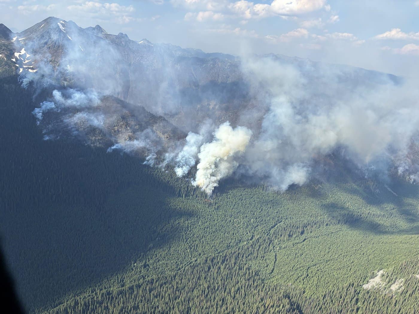 Fire crews work on containment lines between out-of-control blaze and B.C. city